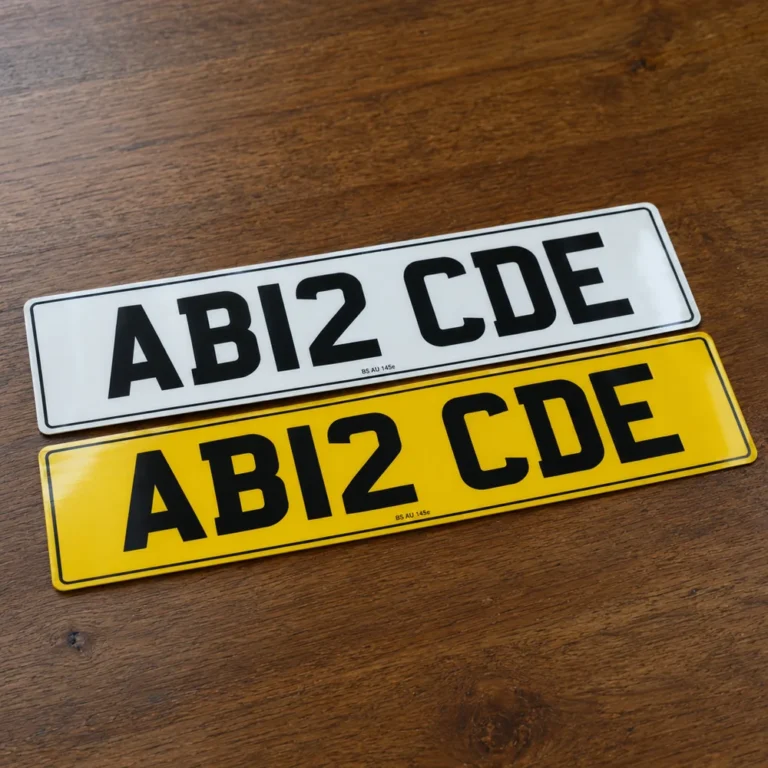 White and yellow printed number plates reading AB12 CDE