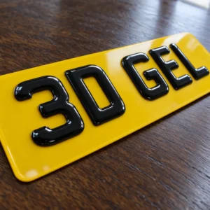 Yellow number plate with glossy domed 3D gel characters reading 3D GEL