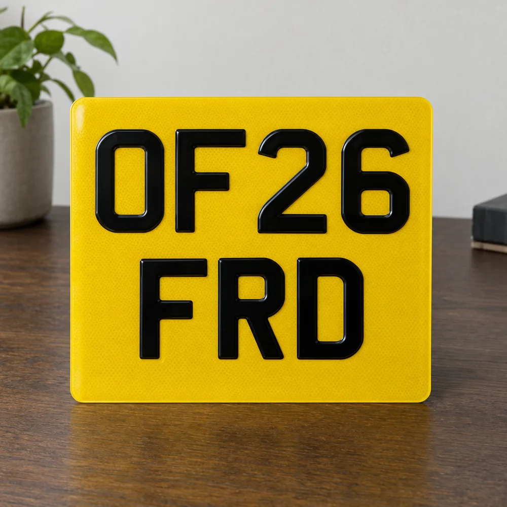 Square yellow two-line number plate reading OF26 FRD
